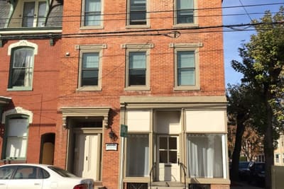 Three-story brick building at 100 S. West St., Carlisle