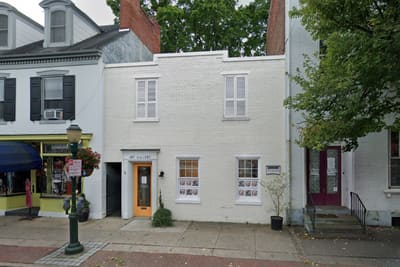White storefront building at 136 W. High St., Carlisle