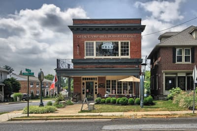 An ornate historic brick building on a street corner