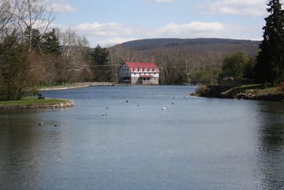 A lake with mountains in the distance